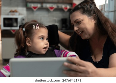 baby with physical disability and mother having fun together. - Powered by Shutterstock