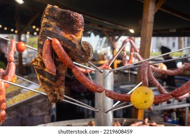 Baby Pig And Raw Pork Sausage On Barbecue Skewers At Spanish Market