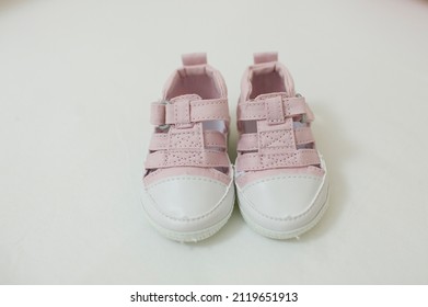 Baby Pink All Star Tennis Shoes With White Background