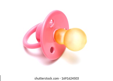 Baby pink mannequin isolated on a white background. Pink baby's pacifier isolated on white background.