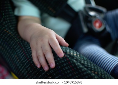 Baby Place His Hand On The Car Seat And Sit Calm. Baby Sit In Rear Facing Car Seat.