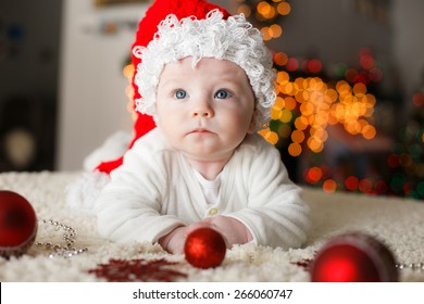 Baby Is Playing With Christmas Ornaments For The First Time