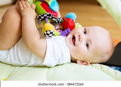 Baby Playing With Colorful Toys