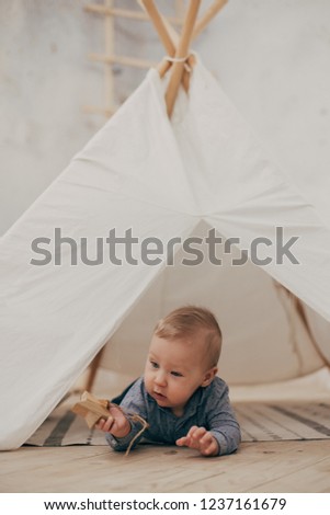 Similar – Der kleine Junge und die Mutter sitzen an der Hängematte.