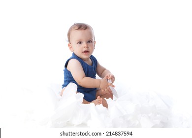 A Baby Playing With Lots Tissue Papers, Isolated On White