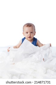 A Baby Playing With Lots Tissue Papers, Isolated On White