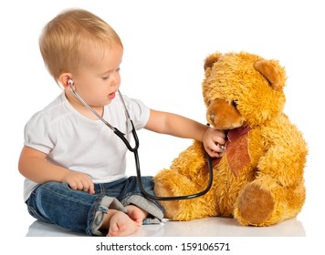 Baby Plays In Doctor Toy Bear And Stethoscope