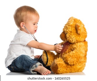 Baby Plays In Doctor Toy Bear And Stethoscope