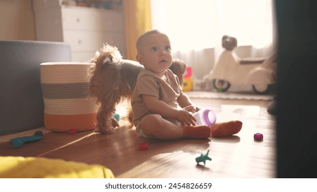 baby plays on floor with toys. happy family kid dream concept. baby shakes a plastic bottle plays with a toy development of fine motor skills. baby toddler playing on the floor in lifestyle room - Powered by Shutterstock