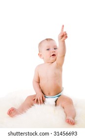 Baby Pointing Up Sitting On Fur Isolated On White