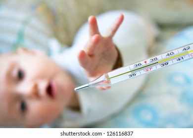 Baby Pulls His Hand To The Thermometer