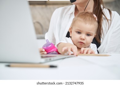 Baby Reaching Out And Taking Pencil From Table