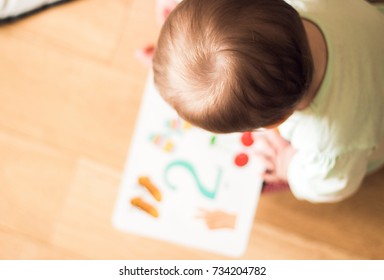 Baby Reading A Book, Top View