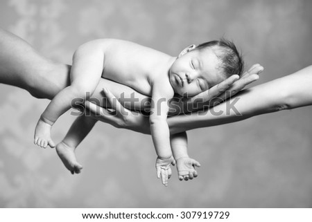 Similar – Newborn sleeping lying on blanket