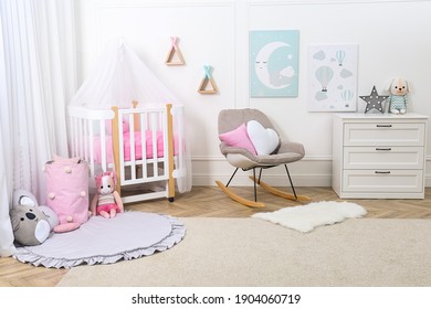 Baby Room Interior With Toys And Stylish Furniture