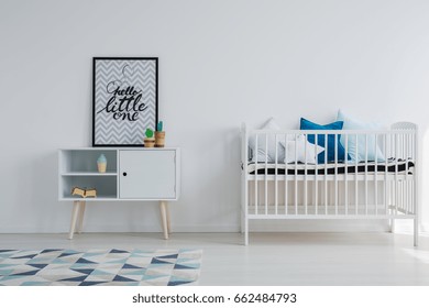 Baby room in scandi apartment with vintage furniture