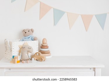 Baby room with wooden toys, plush animals and pennant garland - Powered by Shutterstock