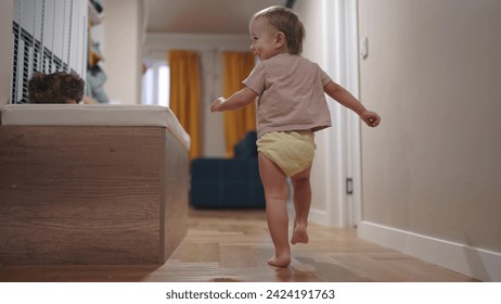 baby run along corridor indoors. happy family kid dream concept. baby first steps playing run around at home. son, child, active, runs, takes first steps, plays lifestyle indoors - Powered by Shutterstock