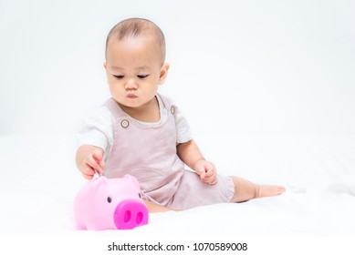 Baby Save Money To Pink Piggy Bang On The Bed