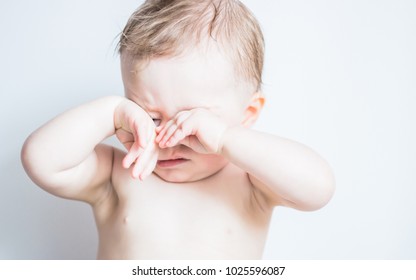 Baby Scratching Her Eyes, Sleepy Child Isolated On White. Tired, Exhausted, Problems With Sleeping, Hyper Activity Disorder, Sad Baby Concept