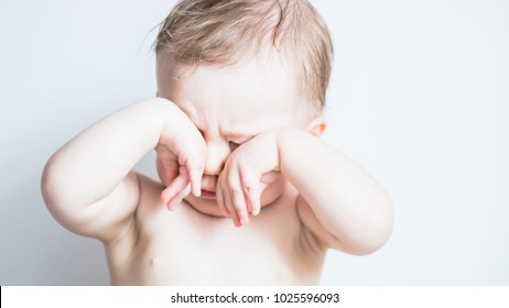 Baby Scratching Her Eyes, Sleepy Child Isolated On White. Tired, Exhausted, Problems With Sleeping, Hyper Activity Disorder, Sad Baby Concept