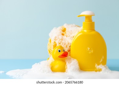 Baby Shampoo  On A White  Background, Rubber Yellow Ducks, Soap Foam. Bathroom Accessories