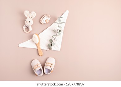 Baby Shoes, Rattle And Teether On Neutral Background. Organic Newborn Gifts