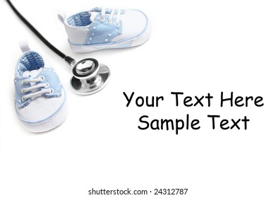 Baby Shoes With Stethascope Against A White Background.