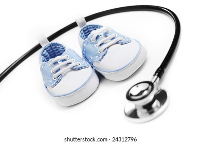 Baby Shoes With Stethascope Against A White Background.