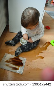 Baby Siting On The Messy Floor