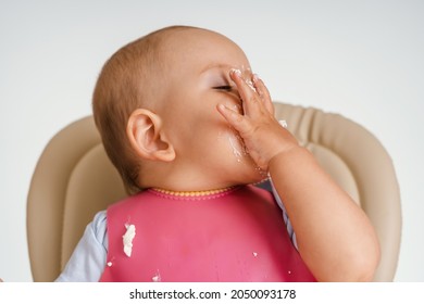 The Baby Sitting On A Chair During Feeding Made A Facepalm Gesture