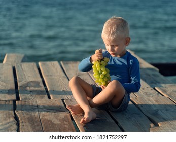 Baby Sitting On The Sea
Eating Grapes