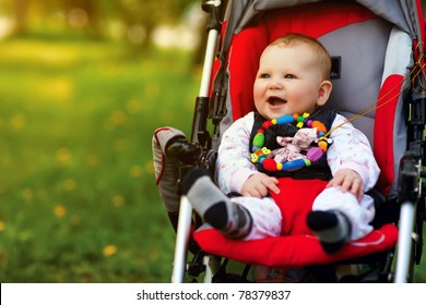Baby in sitting stroller on nature