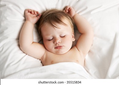 Baby Sleeping In Bed