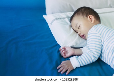 Baby Sleeping In Bed And Dream.Asian 2 Years Old Baby Boy Sleep On The Bed In Bed Room.Night Time,peaceful And Growth Hormone Concept.