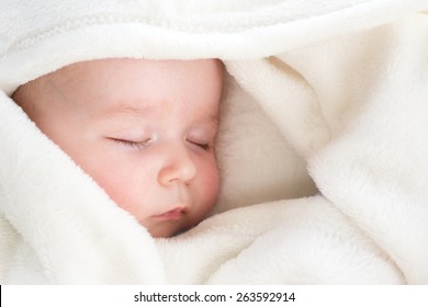 Baby Sleeping Covered With Soft Blanket