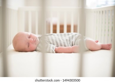 Baby Sleeping In A Crib