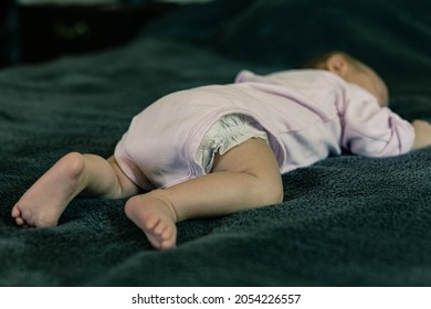 A Baby Sleeping In A Dangerous Position. Sudden Infant Death Syndrome.