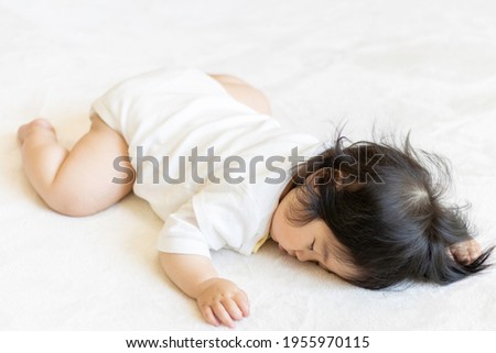 Baby sleeping prone (0 years old, 9 months old, Japanese, girl)