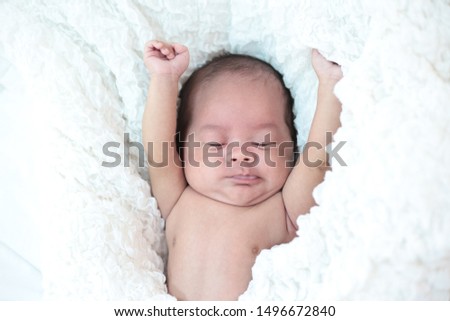 Similar – Image, Stock Photo Baby girl wrapped in a blanket