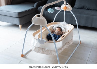 baby sleeps with a cradle