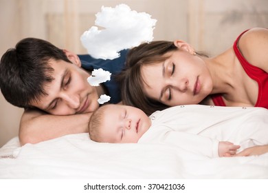 Baby Sleeps  With Tired Parents