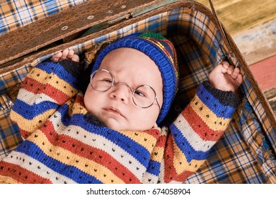 Baby In Spectacles. Child In Suitcase Close Up. The Future Scholar.