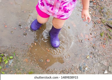 Baby Stomping On A Puddle