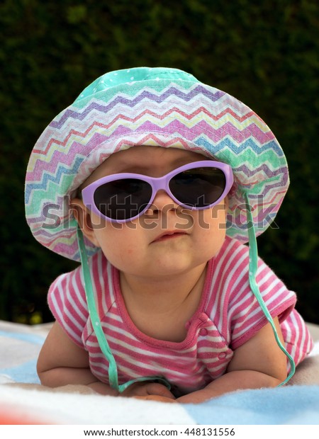 baby sun hat and sunglasses