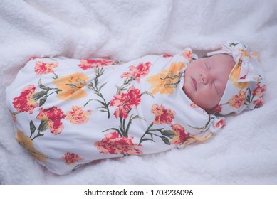 Baby Swaddled In Flower Blankets