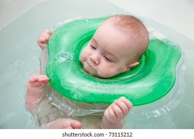 Baby Swimming With Neck Swim Ring In Bath