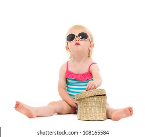 Baby In Swimsuit And Sunglasses Looking Up