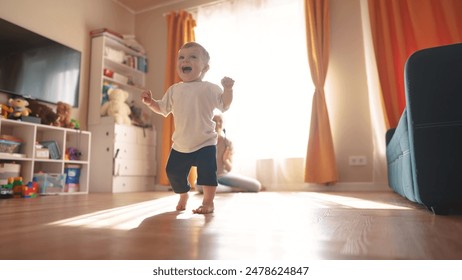 Baby is taking the first steps. happy family kid dream concept. Mom and baby taking the fun first. steps. family together Mom taking the first steps with her baby. toddler. first steps concept. - Powered by Shutterstock