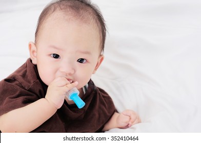 Baby Taking Medicine With Dropper